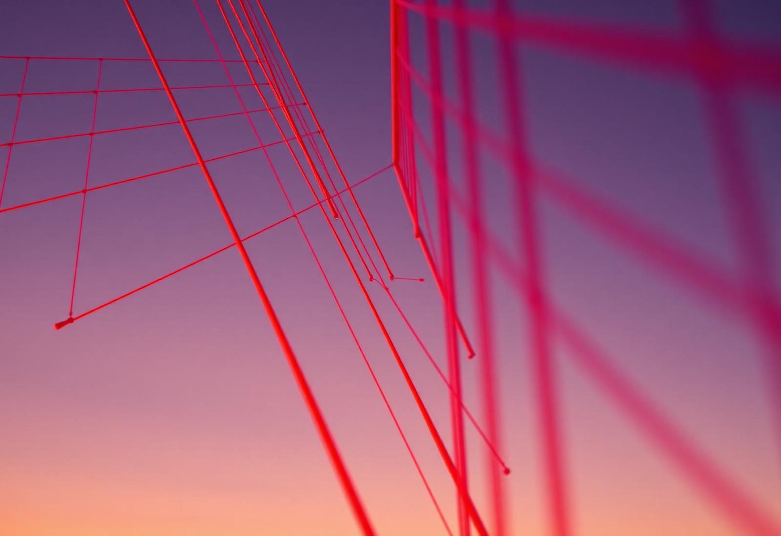 Warm architectural bridge cables at golden hour